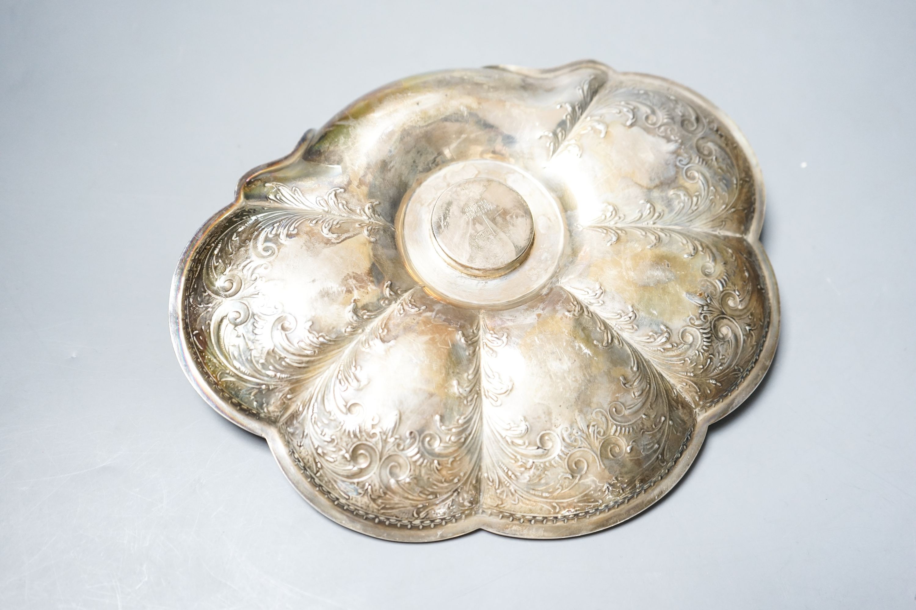 A late Victorian engraved silver shell shaped inkstand with single well, by Walker & Hall, Sheffield, 1897, 23.8cm, gross 14.5oz.